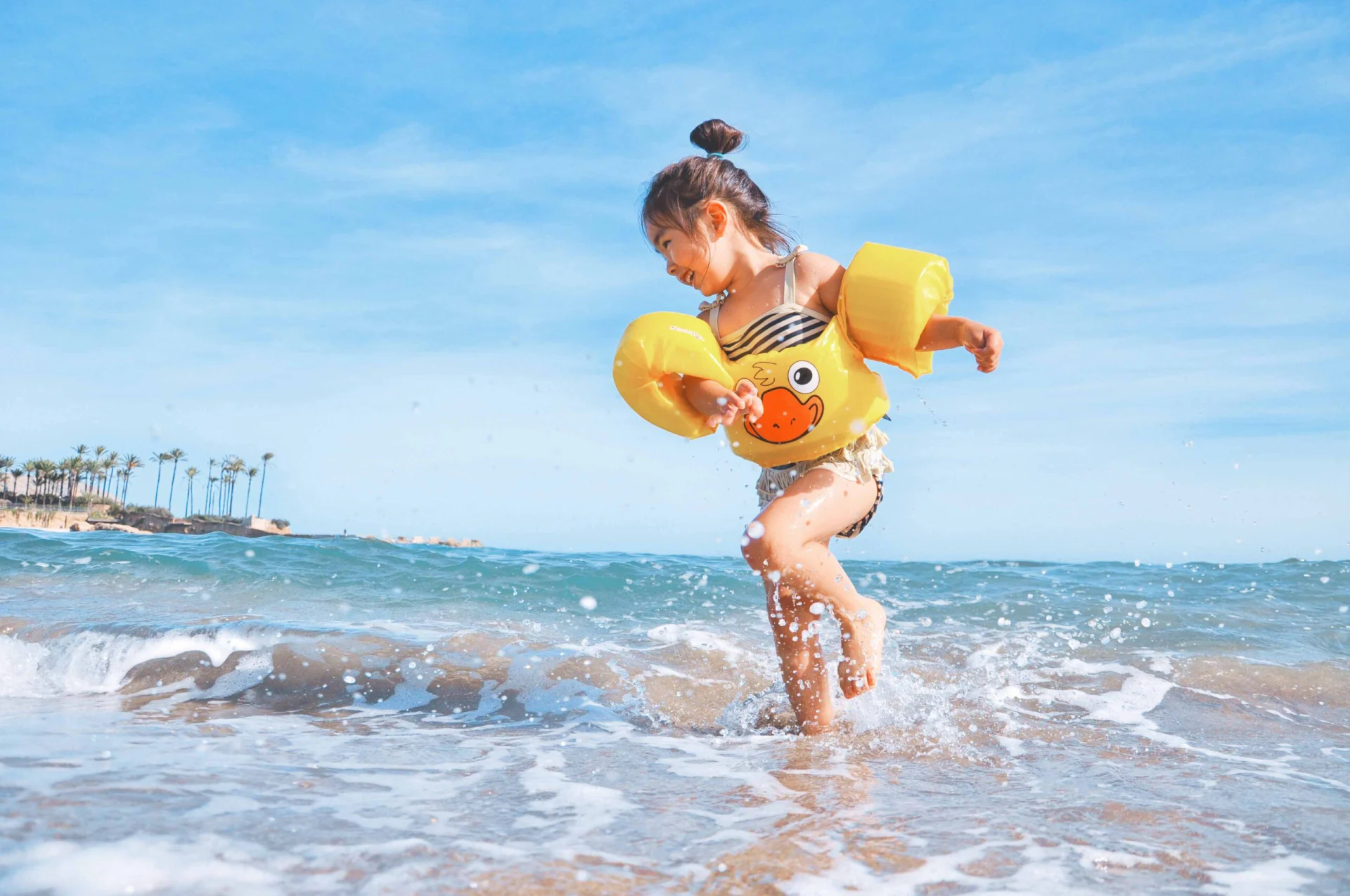Kid playing on the beach